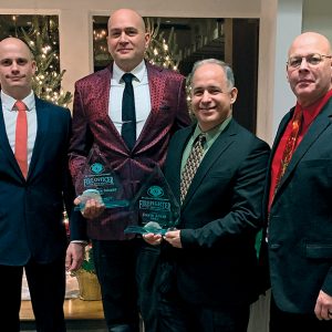 Mt. Lebanon Volunteer Fire Company president Steve Noorbakhsh, far left, presents awards to Lt. Kris Siegert and Firefighter Dave Adler, center. Far right is Chief Nick Sohyda.