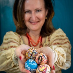 Sasha Phillips holds a collection of pysanky eggs in her hands