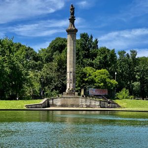 pond with tall statue