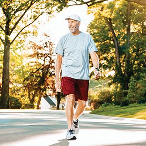 man walking in neighborhood