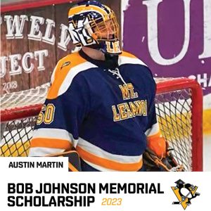 teen in hockey gear at goal on ice