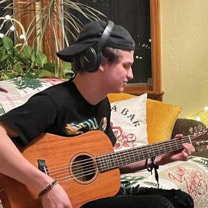 teen playing guitar