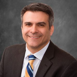 headshot of man in suit