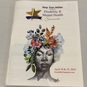 pamphlet for Disability and Mental Health Summit with woman that has flowers growing out of her head