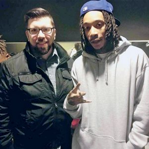 two men smile in photo