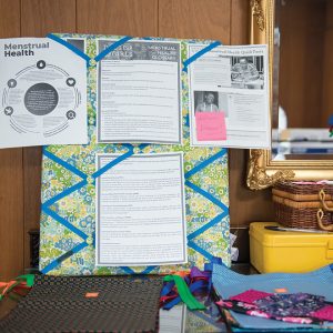 billboard with papers and fabrics