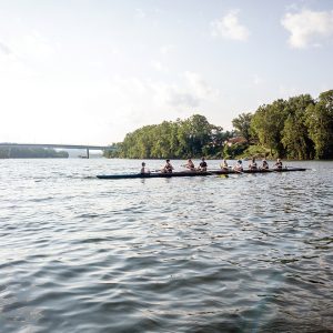 group of rowers in a kayak on a river