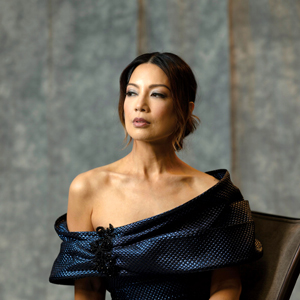 portrait of women with hair pulled back looking to side