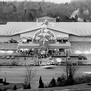 black and white photo aerial shot of mall and parking lot