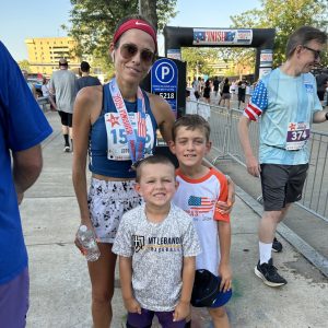 woman with two small children at a race