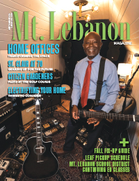 Mt. Lebanon Magazine cover with man in tie holding guitar