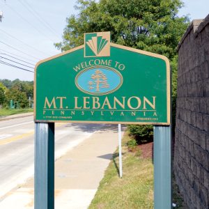 A sign that says "welcome to Mt. Lebanon" at the city line