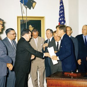 men in suits in Oval Office