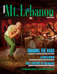 Mt. Lebanon Magazine November cover. Man singing on stage with band