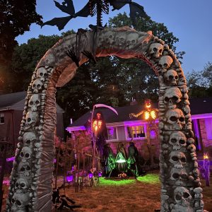 ranch home with Halloween decorations. skulls, skeletons and purple lighting