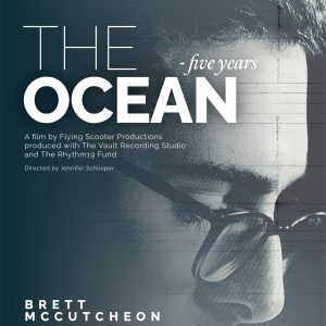 The Ocean - Five Years Poster for a film. upclose image of man with glasses looking down