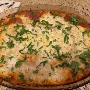 baked enchiladas in a glass dish