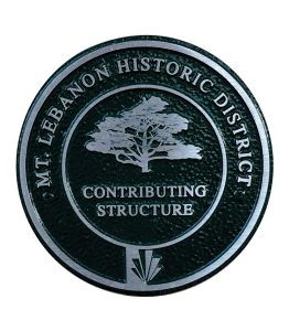 A Mt. Lebanon historic district medallion, showing a tree over the words "contributing structure" on top of the Mt. Lebanon Municipality logo.