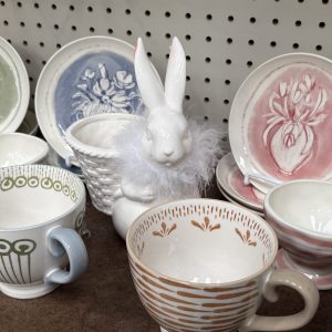 tea sets in pastel colors with a ceramic bunny