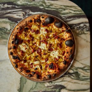 Leek and guanciale pizza