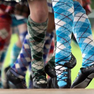 dancers legs wearing tartan knee high socks while dancing
