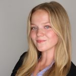 professional headshot of young woman with blonde hair smiling