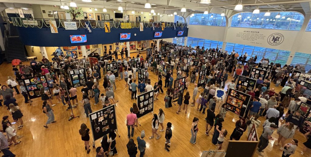 aerial shot of an art show in a high school