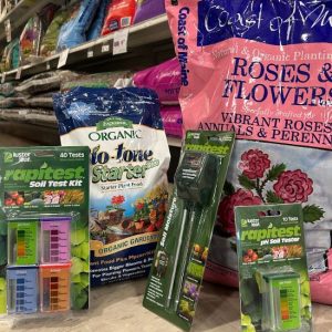 garden products, a pink bag and several packages, in a hardware store