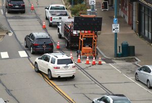 construction sign and cars on a street