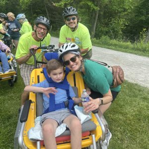 Adaptive biking participant and family.