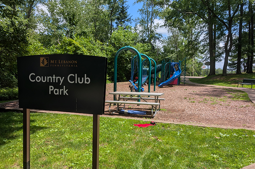outdoor playground with sign that says country club park