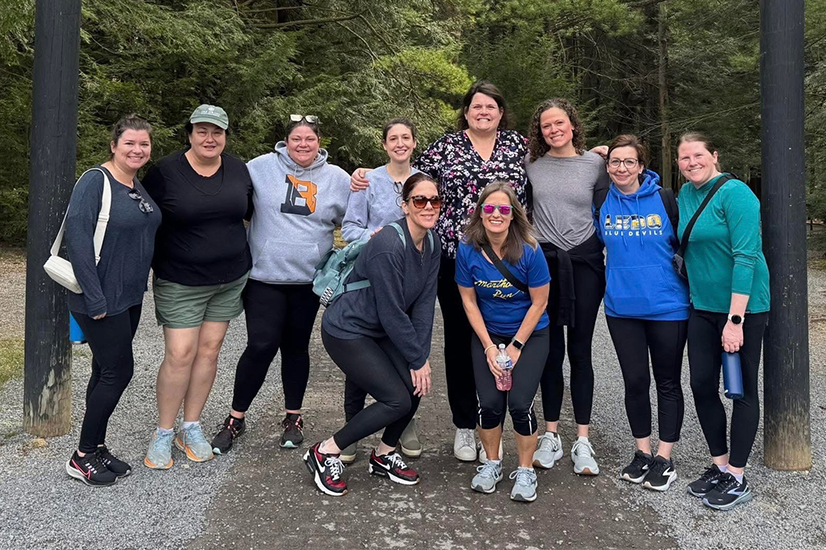 group photo of women on an outdoor trail