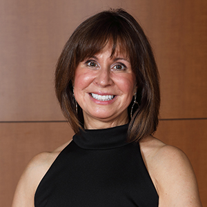 woman smiling in black top