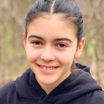 teen girl with hair pulled back and hoodie