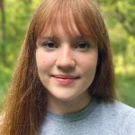 headshot of teen girl with orange hair