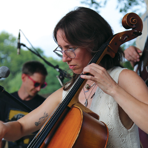 woman with glasses playing cello