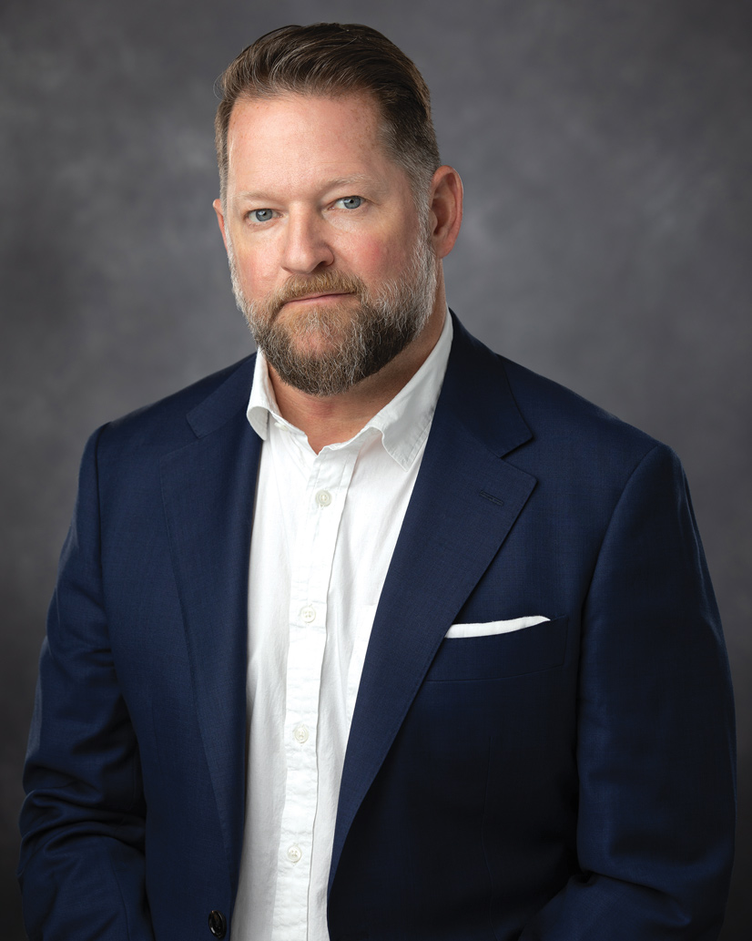headshot of man in suit