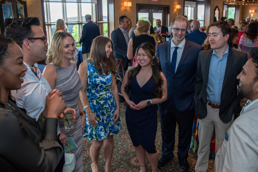 people in formalwear at a benefit