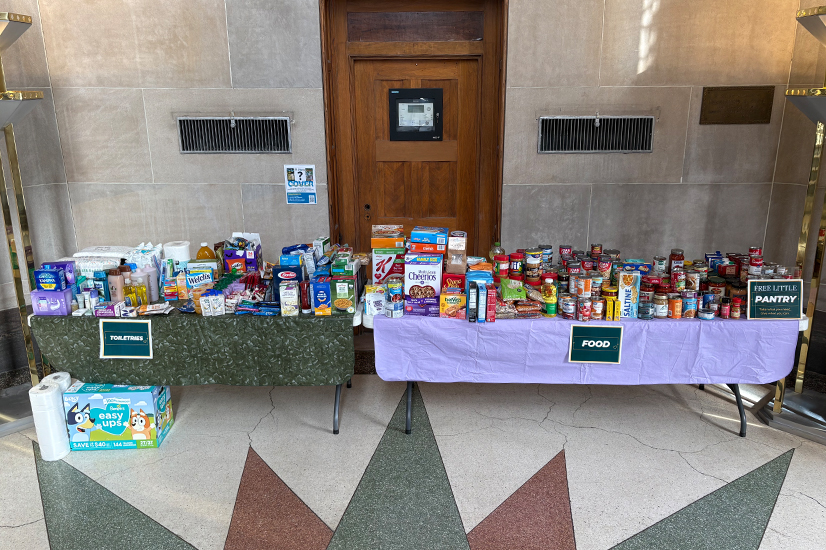 tables of food and personal hygiene items in a lobby