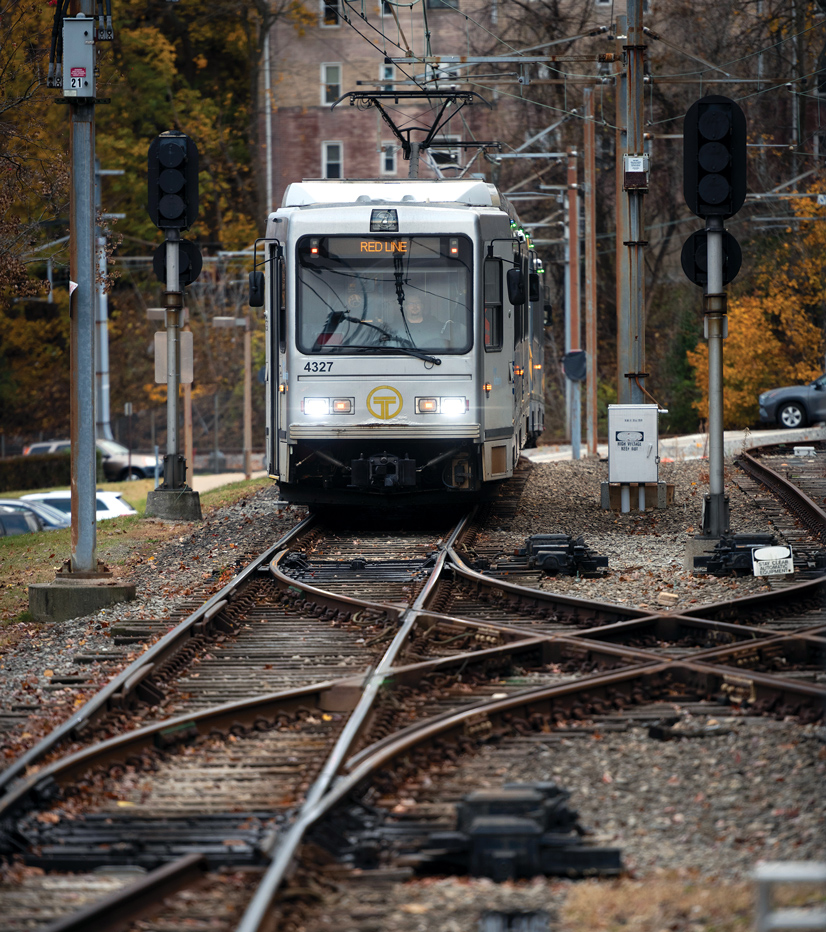 A train coming down railroad tracks on a gloomy day in Mt. Lebanon.