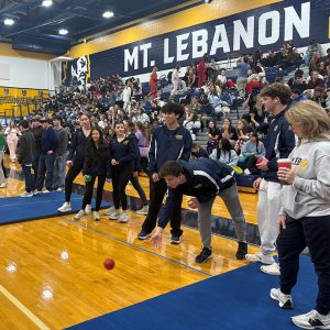high school students in a gym playing bocce