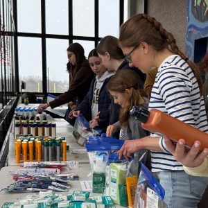 Volunteers assembling personal care kits