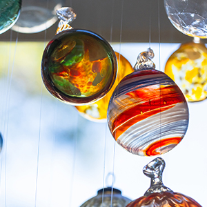 glass-blown art hanging in window