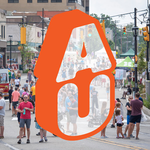 urban street with people walking with orange letters of AU over top of it