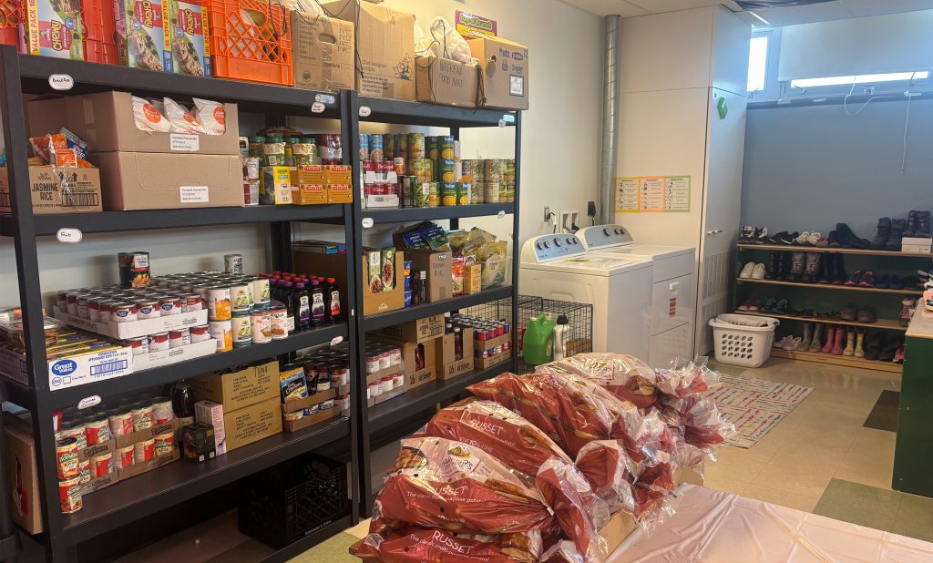 food and clothing on the shelves of the new pantry at Arlington