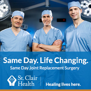 ad for st clair health with three doctors in blue scrubs