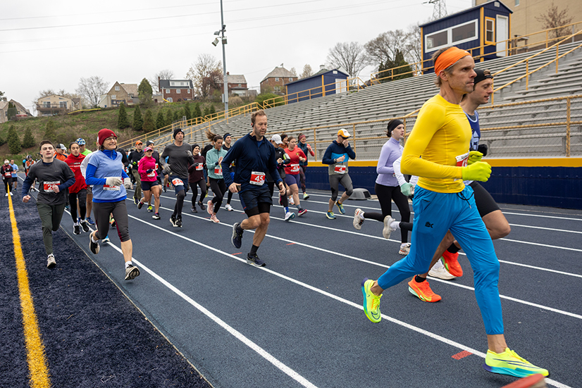 people running on track