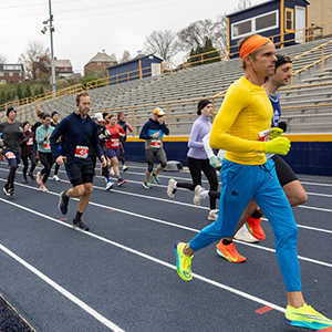 people running on a track outdoors