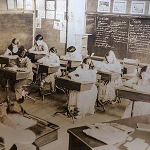 old photo of schoolroom from 100 years ago