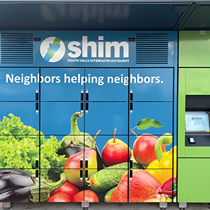 food lockers outdoor with SHIM logo and produce on it